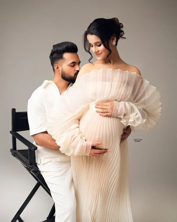 Pure serenity. This couple's portrait in coordinating white outfits is so angelic and peaceful. I love capturing the gentle affection between partners.