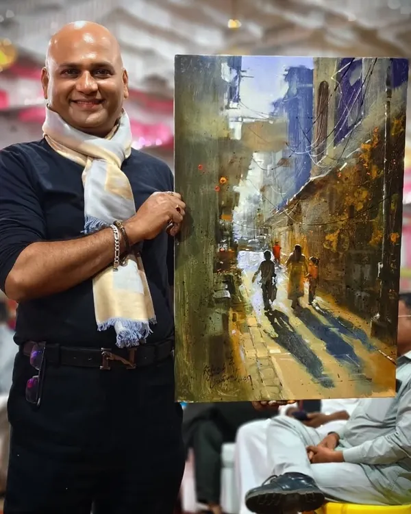 Holding my completed acrylic landscape painting after a live demonstration for the State Level Art Teachers' Art Council in Nandurbar.
