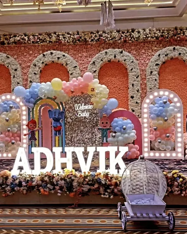 **Hero Item.** This is the kind of large scale Cocomelon themed party I love to create. I designed a complete stage setup with a custom printed backdrop, a shimmering sequin wall, marquee letters spelling the birthday boy's name, and character cutouts to bring the whole world to life.