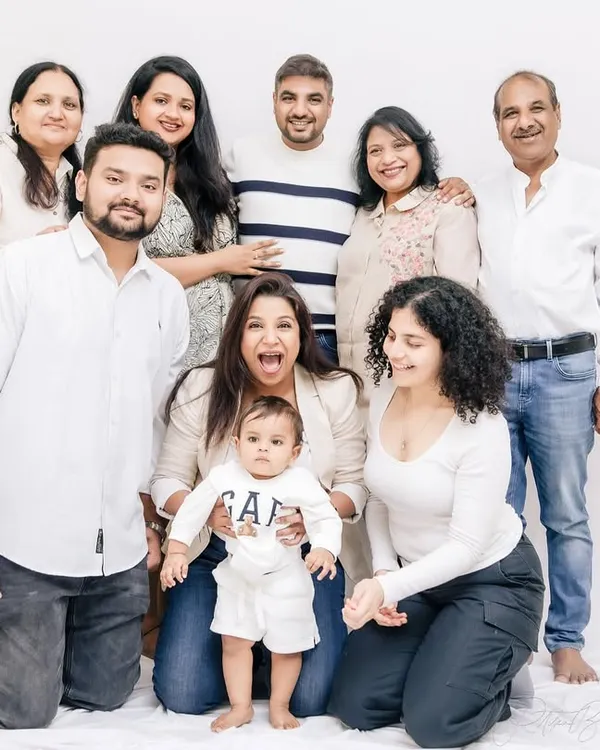 The whole 'khandaan' together. Capturing multiple generations in one frame, from the baby to the grandparents, creates a powerful and lasting legacy portrait for the entire family.