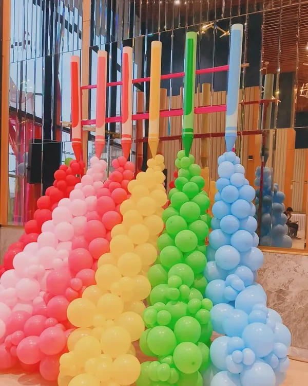 A fun and creative balloon sculpture I made to look like giant crayons spilling color. This kind of playful and imaginative installation is perfect for a creative company's event, a product launch, or a corporate family day.