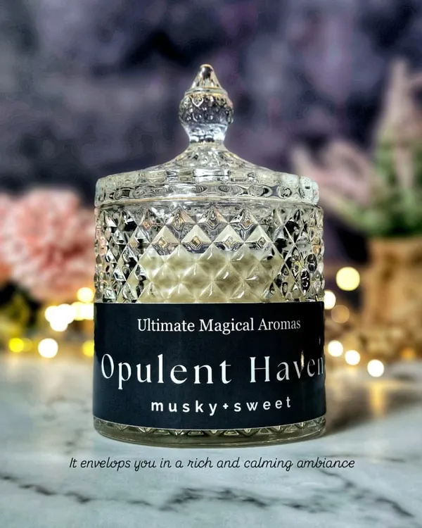 My luxurious Large Crystal Jar Candle in 'Opulent Haven'. This elegant masterpiece, with its musky and sweet notes, is designed to envelop you in a rich and calming ambiance.