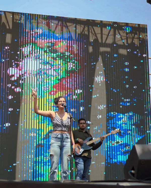 On stage at the Under 25 Summit. Performing with a full band and a giant LED screen behind me was such a surreal experience. This is the energy I bring to large-scale music festivals.