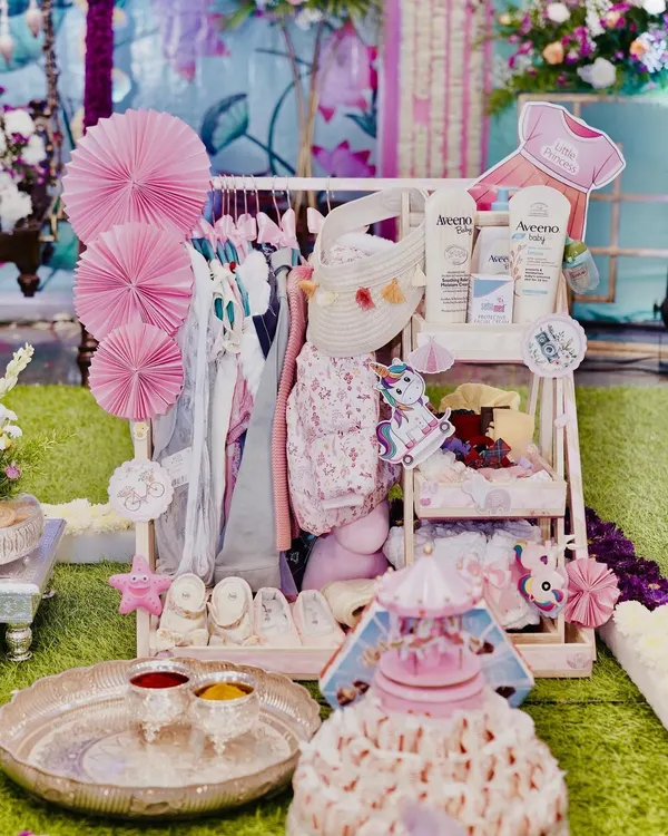 A modern and sweet idea for a baby shower. I created this miniature clothing rack to display baby clothes, shoes, and other gifts, making for a unique and picture-perfect addition to the celebration.