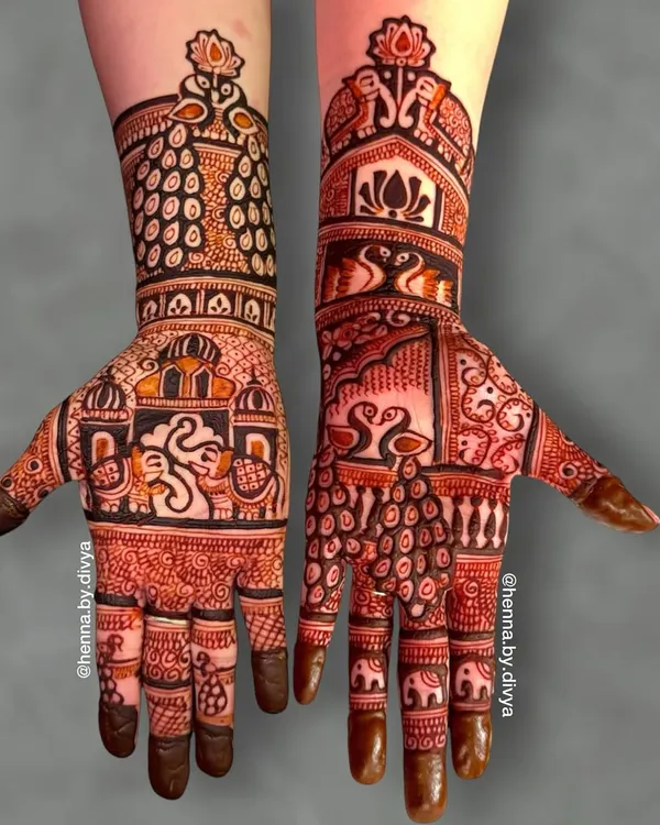 A royal-themed design featuring a majestic Ganesha in a palace window on one palm. The other hand is adorned with swans, peacocks, and elephants, creating a truly grand look.
