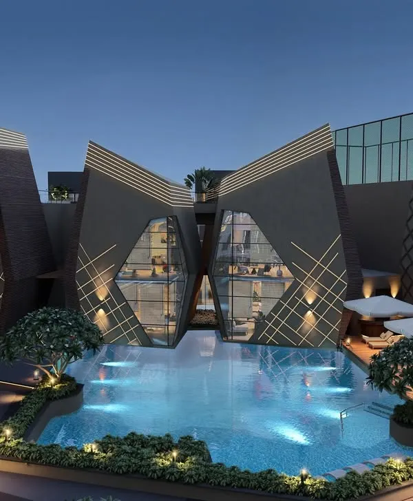 A view of the Kohinoor Uptown clubhouse in Kalyan, where we designed a resort like experience for residents. This space combines dramatic lighting, modern forms, and lush landscaping to create an oasis for relaxation and community gathering.
