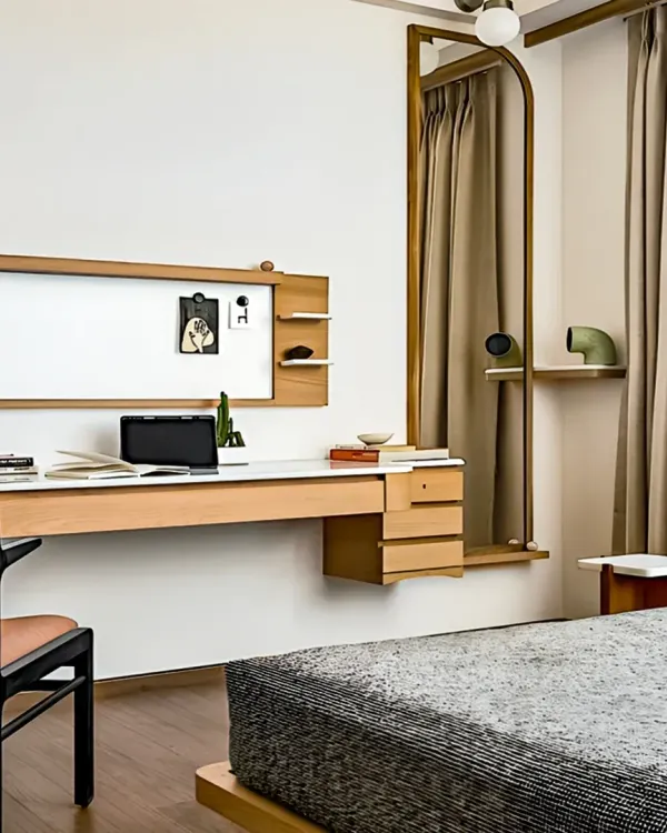 This minimalist study area features a long, floating desk in a light wood finish, providing a spacious and uncluttered workspace. The design includes a built-in whiteboard and discreet shelving for a clean and organized look.