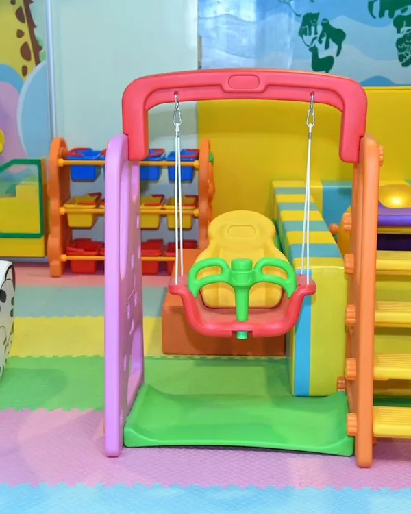 Our dedicated toddler area features this safe and fun swing and slide set. It's perfectly sized for little ones to enjoy and build their confidence.