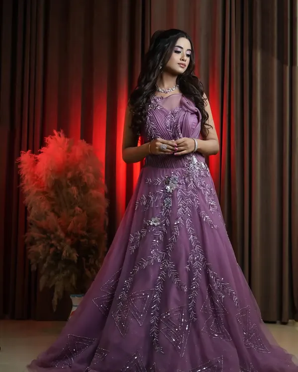 A full length view of our stunning onion pink bridal gown. The flowing tulle skirt and detailed bodice create a romantic and sophisticated look, ideal for capturing elegant reception or engagement photos for your portfolio.