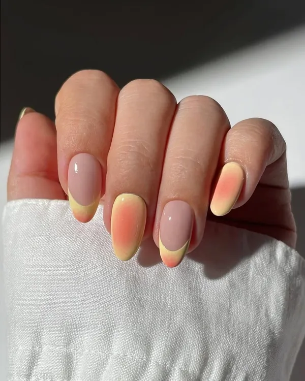 A beautiful ombre effect with a twist. This design features a sunset-inspired gradient on some nails, paired with a modern French outline on others, showing our creative combinations.