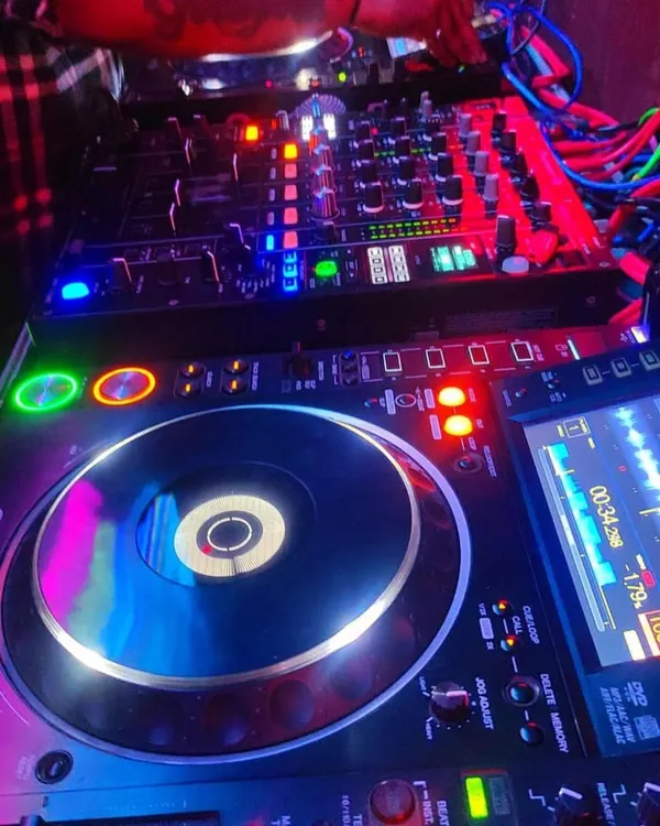 A close-up of my professional DJ gear, the heart of the party. I use industry-standard Pioneer CDJs and mixers to deliver crisp, clear sound and seamless transitions all night long.