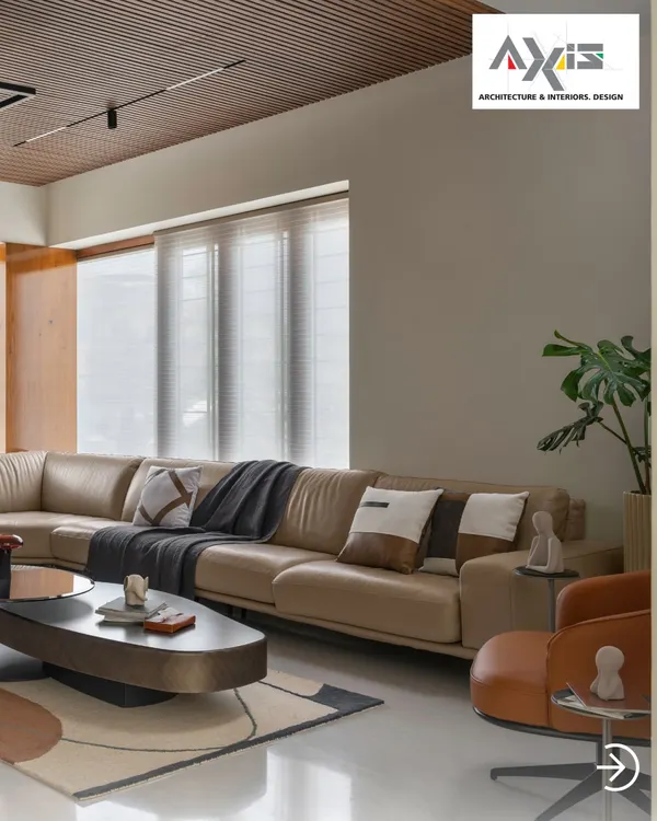 This living hall is an embrace of seamless style and comfort. The large leather sectional, layered rugs, and mix of neutral tones create a sophisticated yet inviting atmosphere, perfect for family life.