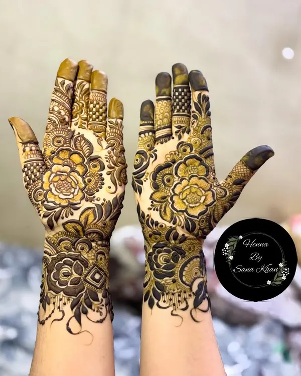 A stunning example of a full-coverage design where I've combined intricate floral work with detailed patterns on the fingers and wrist. The shading creates a beautiful depth, making the flowers pop.