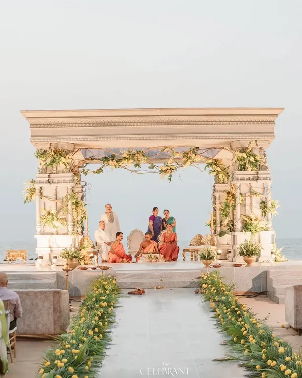 A wide view of the majestic beachside mandap at Sai Radha Heritage. The structure was designed to complement the vastness of the sea, creating a truly epic setting for the wedding vows.