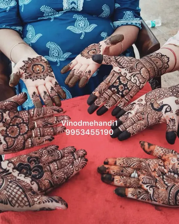 A beautiful group shot of the bride and her family showing off their mehendi. I can cater to the entire bridal party with a variety of designs.