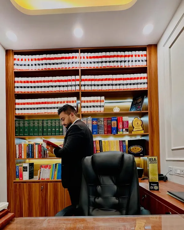In my law office, preparing for a case. Every file represents a person's trust, and I dedicate myself to ensuring their story is heard and justice is delivered.
