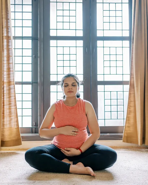 This photo was taken during my own pregnancy journey. I practiced prenatal yoga and followed Garbhasanskar principles daily, which helped me stay active, balanced, and prepared for delivery. This personal experience is the foundation of my coaching, as I share with you the same practices that gave me strength.