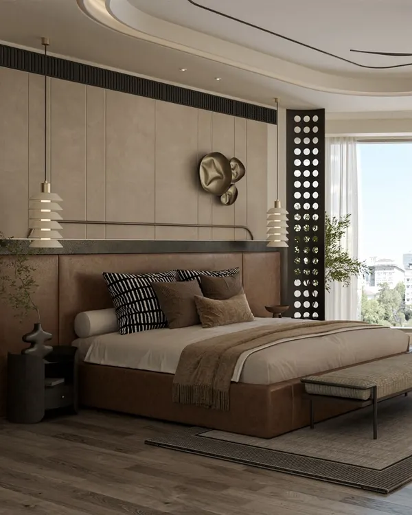 This spacious master bedroom combines a rich leather-finish bed with textured wall panels and a dramatic false ceiling. The design focuses on creating a luxurious yet comfortable atmosphere, with custom lighting and metallic art pieces adding a touch of modern sophistication.
