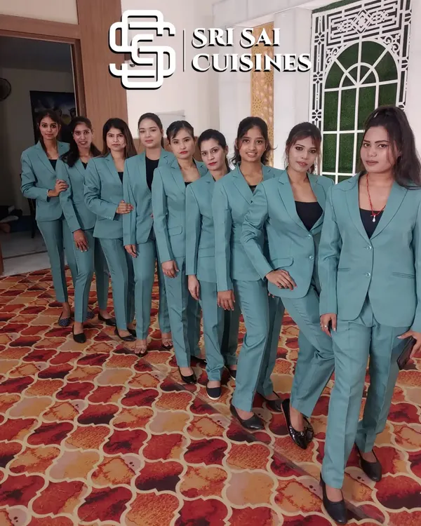 We provide teams of highly professional service staff who present a unified and polished look for your corporate events, weddings, and high-end parties. This team is showcased in our modern and formal blue pantsuits, an attire option that brings a sharp, coordinated aesthetic to any occasion.