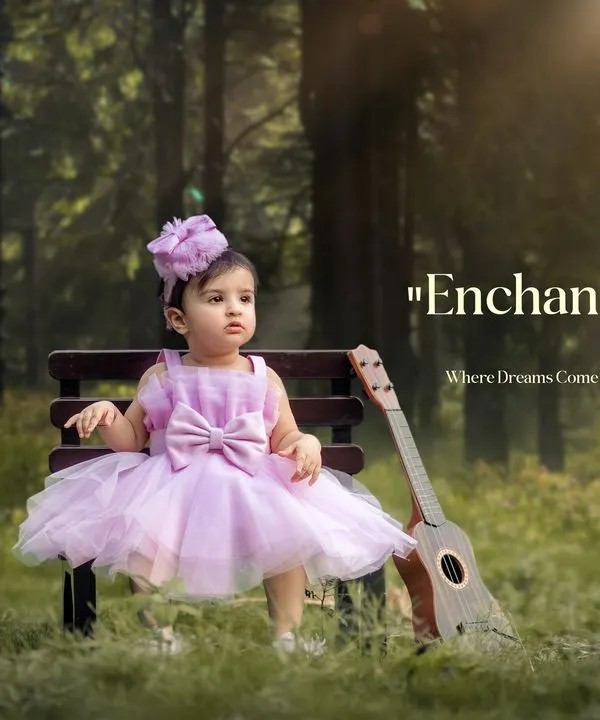 A little girl dressed as a princess sits on a bench in an enchanted forest setting. This portrait uses a ukulele prop and dreamy lighting to create a magical childhood photo.
