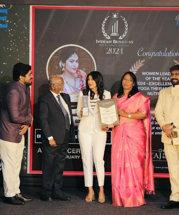 On stage receiving the 'Women Leader of the Year 2024' award for Excellence in Yoga Therapy & Nutrition. This recognition from the Indian Business Excellence Awards validates my holistic approach to wellness.