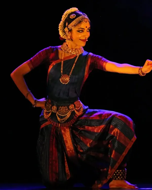 A moment of complete surrender, or 'Shringara Sharanagati', from a recent performance. This pose captures the essence of devotion that I strive to embody in my dance and impart to my students in our Bharatanatyam classes. It represents the core of my artistic expression.