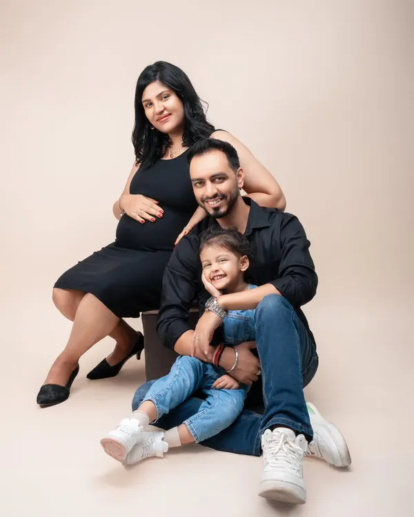 A beautiful family portrait, celebrating the expansion from three to four. The daughter's sweet smile shows her excitement to become a big sister. I love creating these classic, elegant portraits that the whole family will cherish.