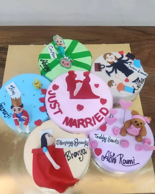 Can't decide on a theme? This unique cake features six different mini-themes in one, including "Just Married," "Sleeping Beauty," and Cocomelon. It's a fun way to celebrate multiple tastes at once.
