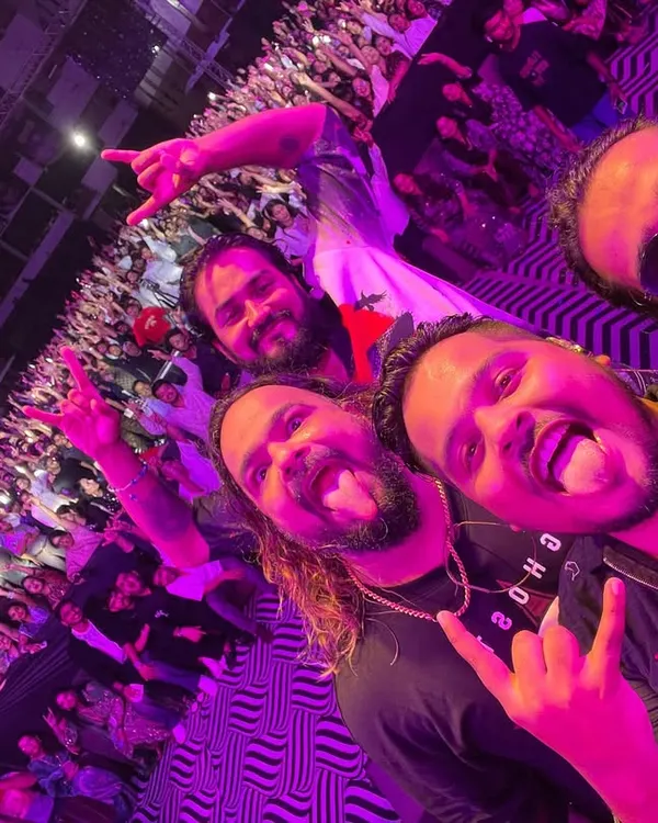 A classic band selfie from the stage, with a massive crowd behind us. This is our happy place, sharing the madness with our fans and each other.