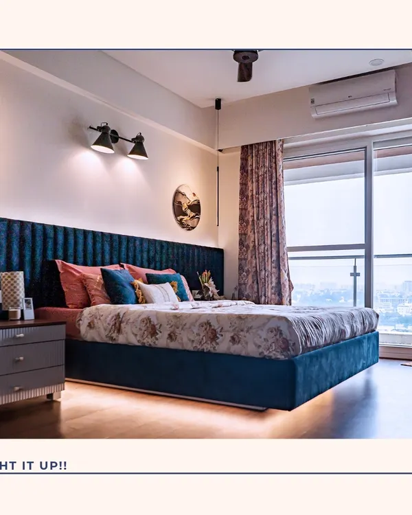 Lighting is key to creating a luxurious atmosphere. This bedroom features a stunning blue velvet channelled headboard with integrated under-bed lighting and elegant pendant lights, creating a soft, ambient glow perfect for winding down.