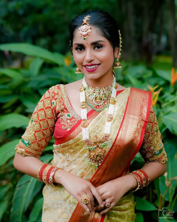 This is how I style a complete bridal look using my Jadau collection. We paired a multi-strand pearl and Jadau haara with a matching choker, maang tikka, and other accessories for a look that is both traditional and vibrant.