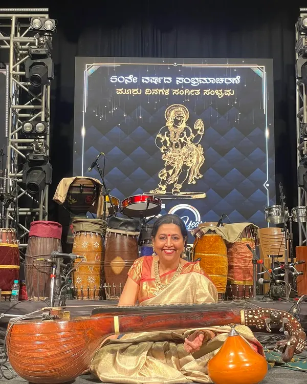 This is me, ready for a concert and completely in my element. I love the energy of a live audience and the moments right before the music begins, with my veena in hand, on a beautifully lit stage.
