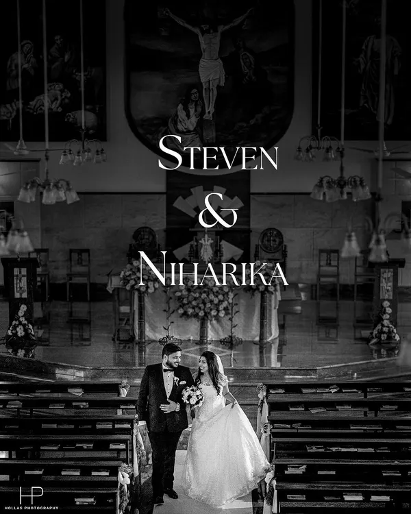 A classic black and white shot of the couple walking down the church aisle, a timeless memory.