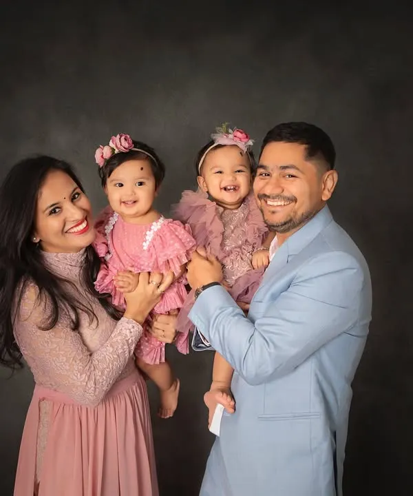 Double the giggles and double the love with these twin queens and their proud parents. This family portrait celebrates the beautiful chaos and joy of having two little ones.