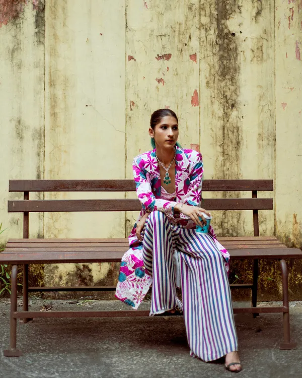 Part of a personal festive lookbook project. I played with print-on-print styling, combining a floral jacket with striped pants for a bold, eclectic look.