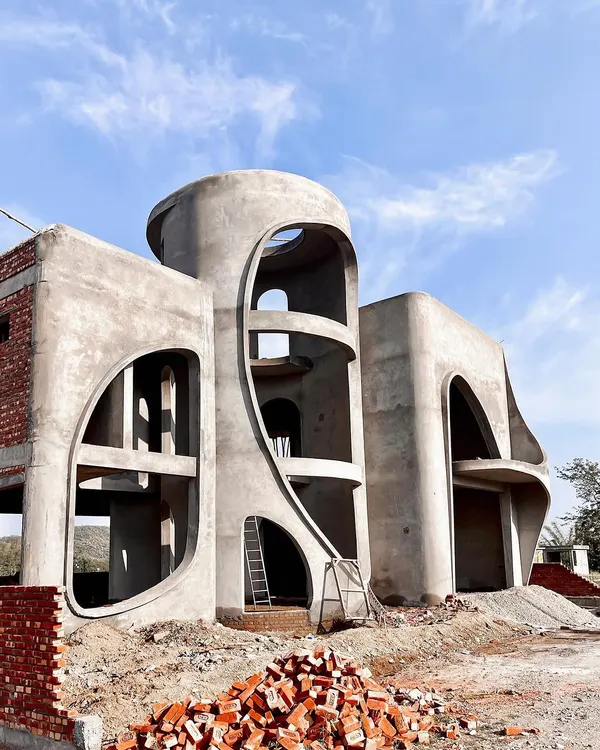 The "La La Land" residence under construction. It's magical to see our vision of a fluid, hill-inspired structure blossoming from mere sketches into a tangible, living form.