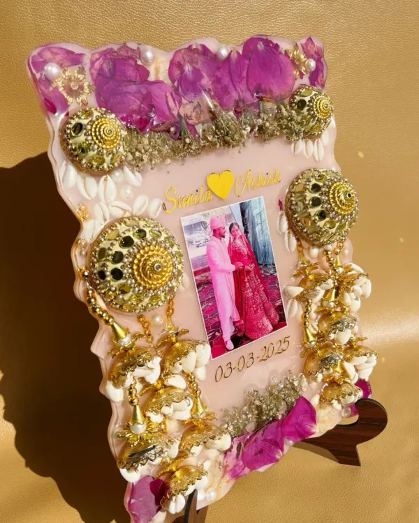I preserved this bride's kalire and wedding flowers in a beautiful resin frame. It includes a photo and the wedding date, creating a unique piece of art from her special day.