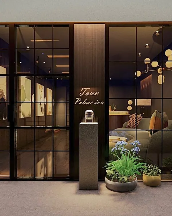 The entrance to the reception area at Town Palace Inn. I used dark framed glass and subtle branding to create a sense of sophisticated arrival for guests.