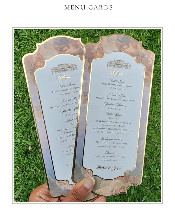 These stunning menu cards were designed for a beautiful wedding in Rome. The design features a classic cherub illustration and elegant typography, printed on custom-shaped cards with a gold foil border.