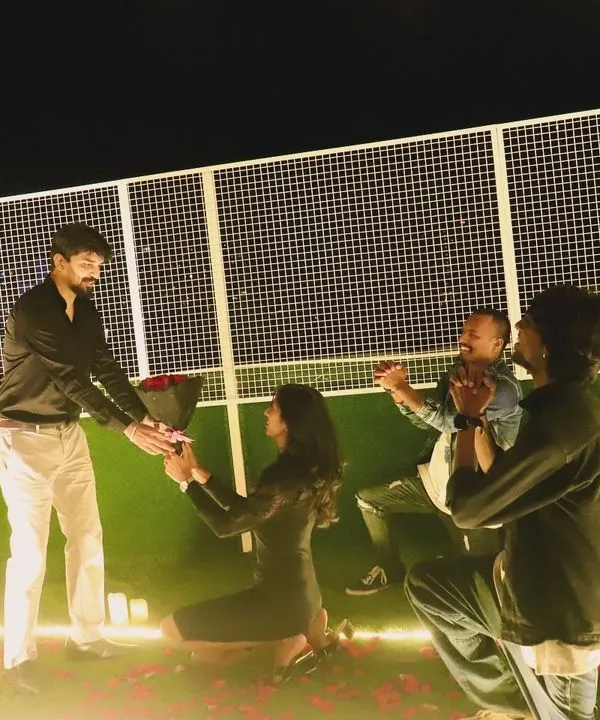 The ultimate question. We set up this beautiful, candle-lit proposal scene on a turf, complete with a heart-shaped floral arch, before our dancers kicked off the surprise.
