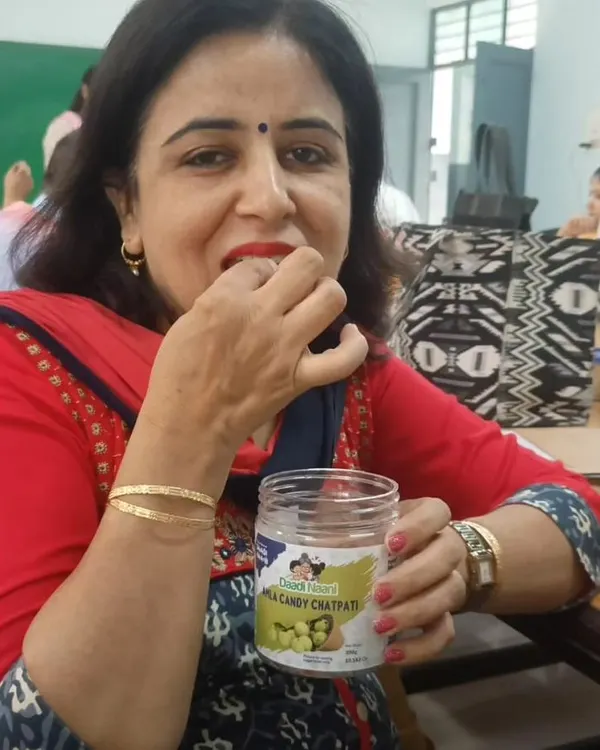 A happy customer enjoying our Chatpati Amla Candy straight from the jar. It's moments like these that make all the hard work in the kitchen worthwhile.