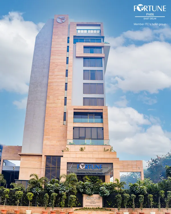 A view of our hotel on a clear day. The building's contemporary design stands as a welcoming beacon for travelers seeking comfort and luxury in East Delhi.