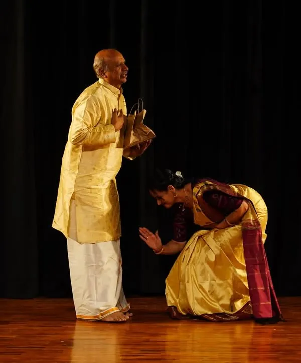 A moment of deep respect. A student seeks blessings before a performance, a gesture that embodies the spirit of the Guru-Shishya tradition.