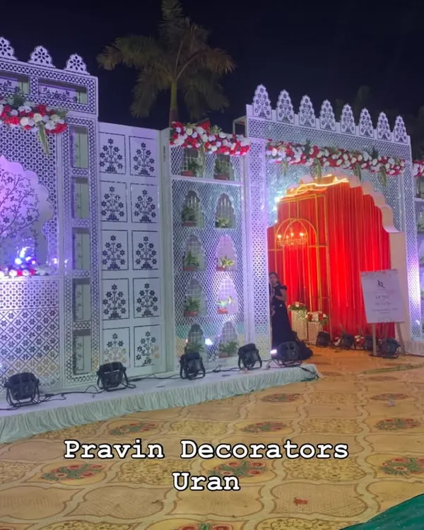 We built this magnificent palace-style entrance gate from the ground up. It features intricate jali work, floral decorations, and dramatic lighting to give guests the feeling of entering a royal wedding.