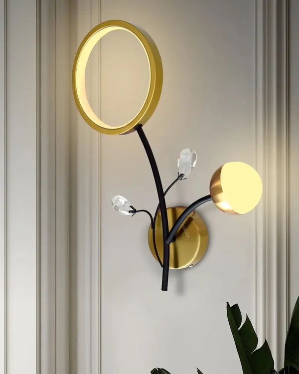 This floral-inspired wall light is a piece of art. It combines a ring light, a globe light, and crystal accents for a beautiful and unique design. It also features a three-color mode to suit your preference.
