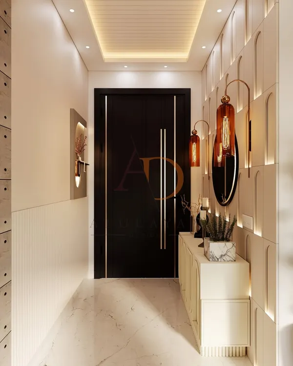 An elegant entryway with custom wall paneling featuring arch grooves and warm backlighting, complemented by a sleek black door with long gold handles.
