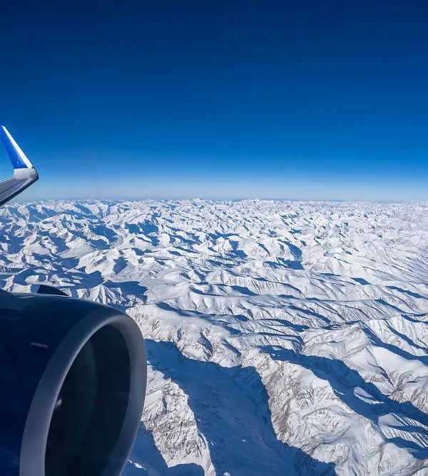 The view from my window seat on a flight to Leh for the Snow Leopard Expedition. The endless expanse of snow-covered Himalayas is a visual treat and a powerful reminder of nature's scale.
