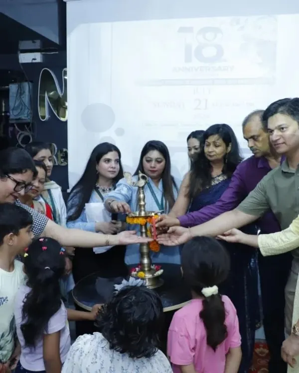 The ceremonial lamp lighting at our 18th-anniversary event. It was a beautiful moment shared with my team, clients, and their families.