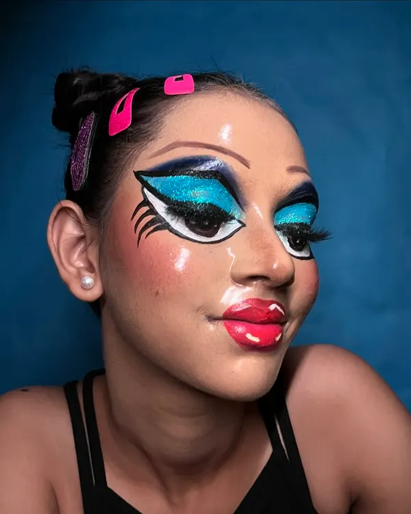 This pop art-inspired look is a perfect example of how I bring creative concepts to life for television and video photography. It involves specialized techniques like eyebrow erasing and creating a 'glass skin' effect to achieve a surreal, doll-like finish that is vibrant and flawless on camera.