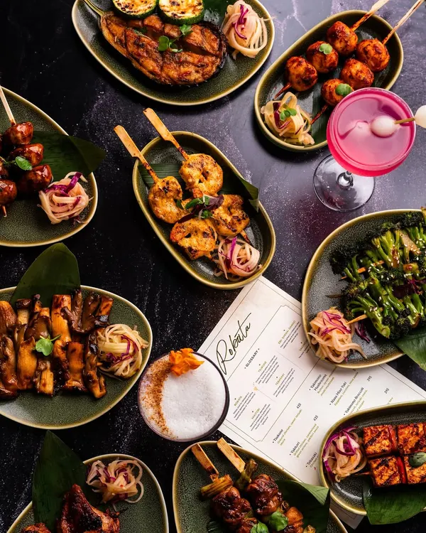 A beautifully styled spread for China Bistro, showcasing a variety of dishes in a single, compelling top-down shot. This type of photography is perfect for menu covers, banners, and highlighting the breadth of your offerings.